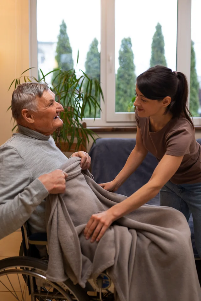Compassionate care at Granada Residence - A caregiver providing support to a resident